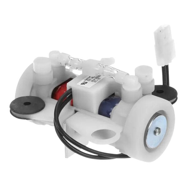 A white Manitowoc Ice air compressor with black and red wires.