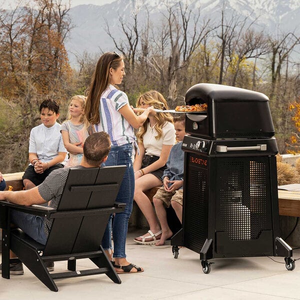 A Blackstone outdoor pizza oven on a patio.