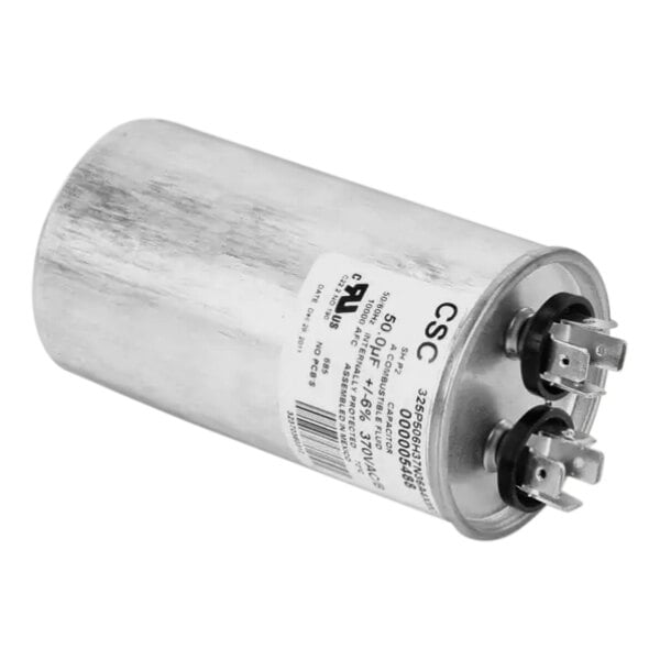 A silver capacitor with a white label.