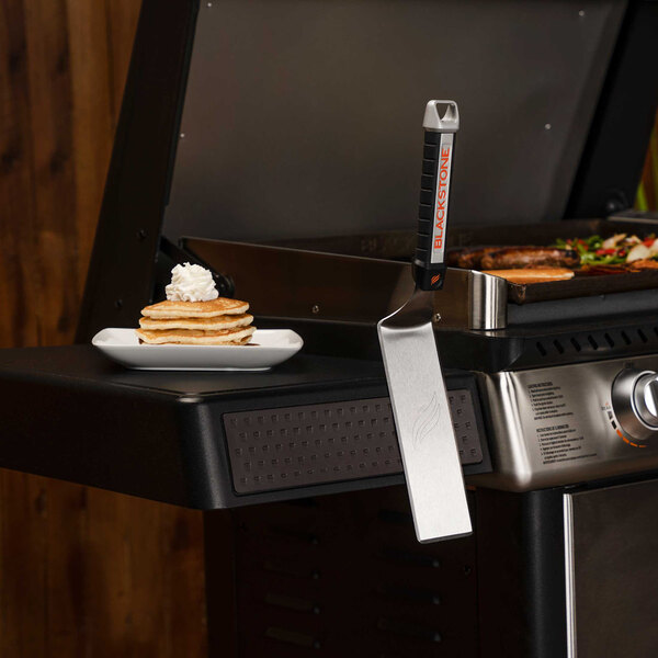 Blackstone outdoor griddle with pancakes cooking on it.