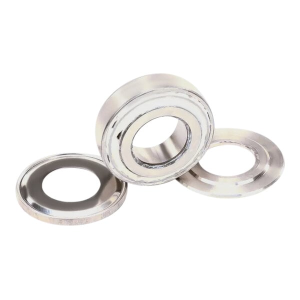 Two Manitowoc stainless steel bearings and rings.