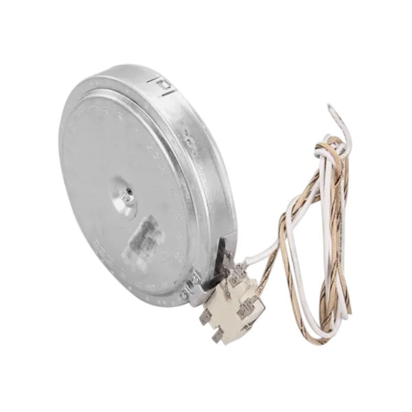 A round metal object with a wire attached to it.