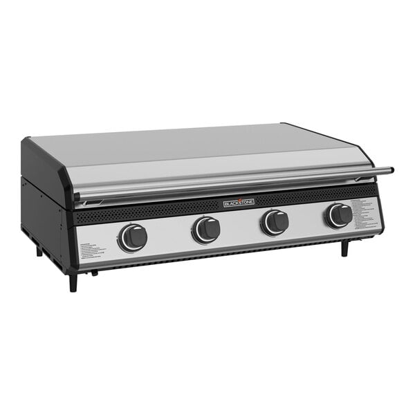 A black and silver Blackstone outdoor kitchen griddle with a hood.