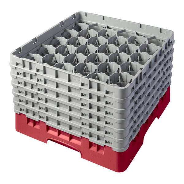 A red plastic Cambro glass rack with grey extenders.