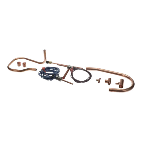 A copper pipe and wires used to convert a compressor for a Manitowoc Ice machine.