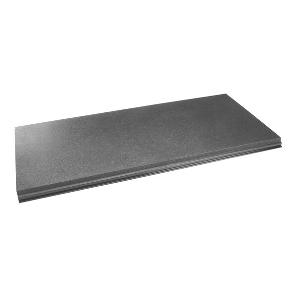 A black and gray Manitowoc Ice door assembly on a table.