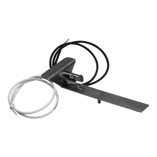 A metal piece with a black and white wire attached to it.