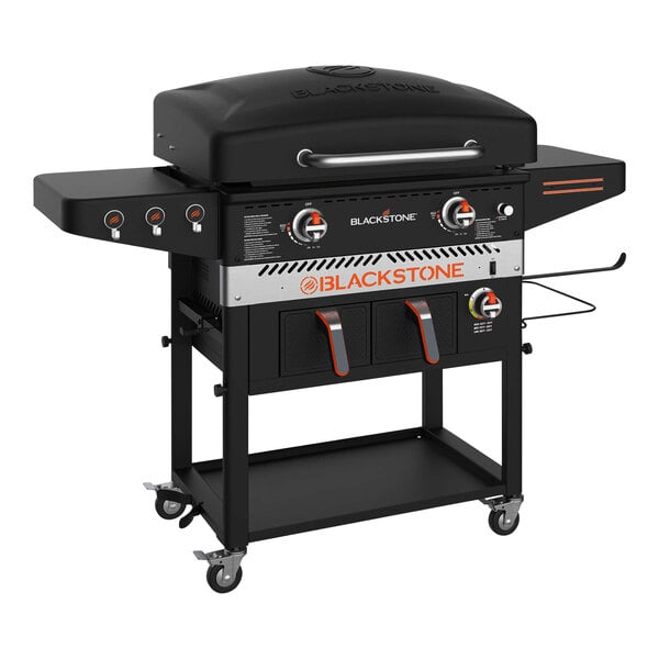 A Blackstone black barbecue grill on wheels.