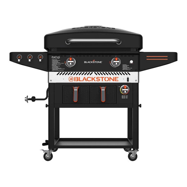 A Blackstone liquid propane griddle with air fryer on a table.