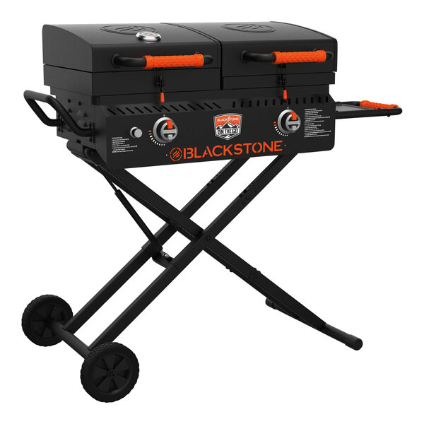 A Blackstone liquid propane outdoor griddle with grill over two burners on a table.
