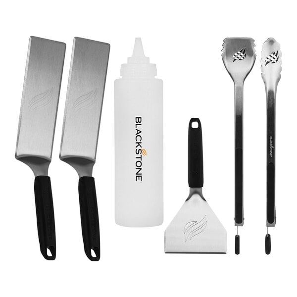 A Blackstone Griddle Essentials 6-Piece Deluxe Toolkit in a white box with black text. The set includes grill tools.
