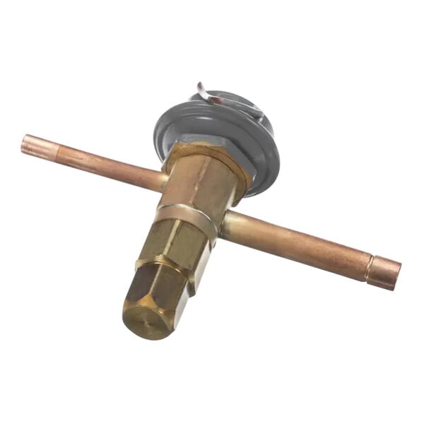 A close-up of a Manitowoc Ice harvest pressure valve with a brass and copper valve.
