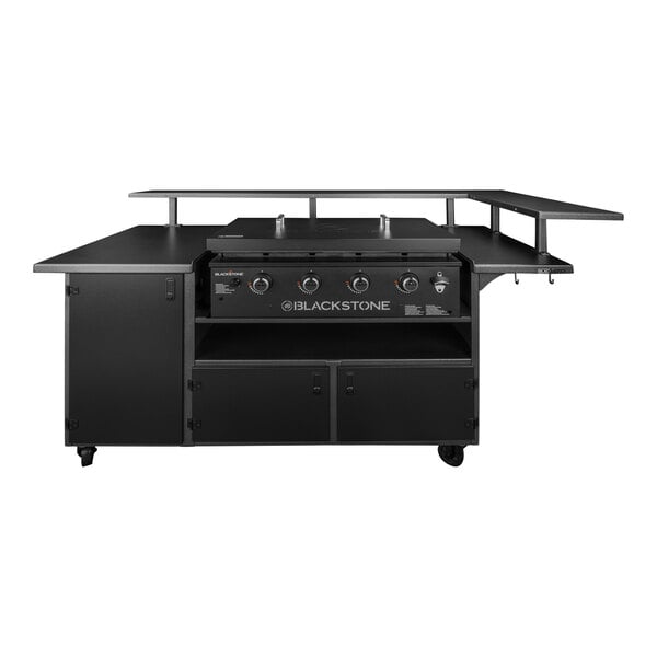 A Blackstone outdoor griddle on a table with a metal shelf.