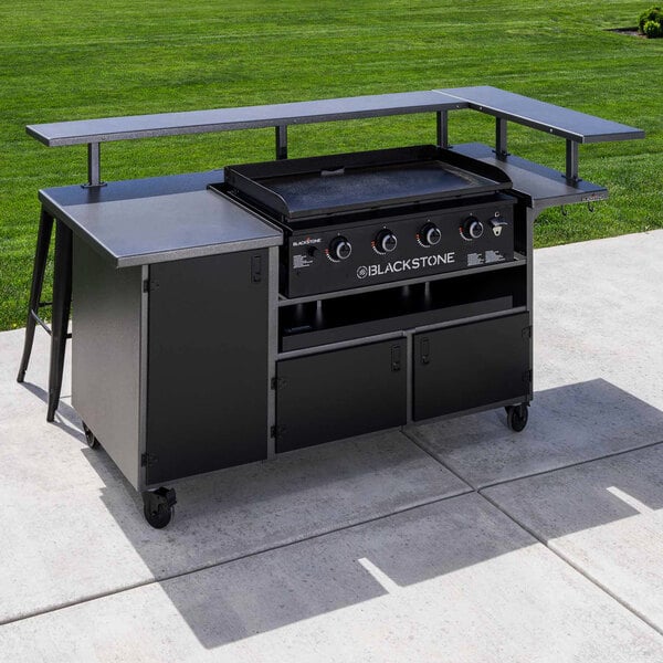 A Blackstone outdoor kitchen with a grill and griddle on a concrete patio.