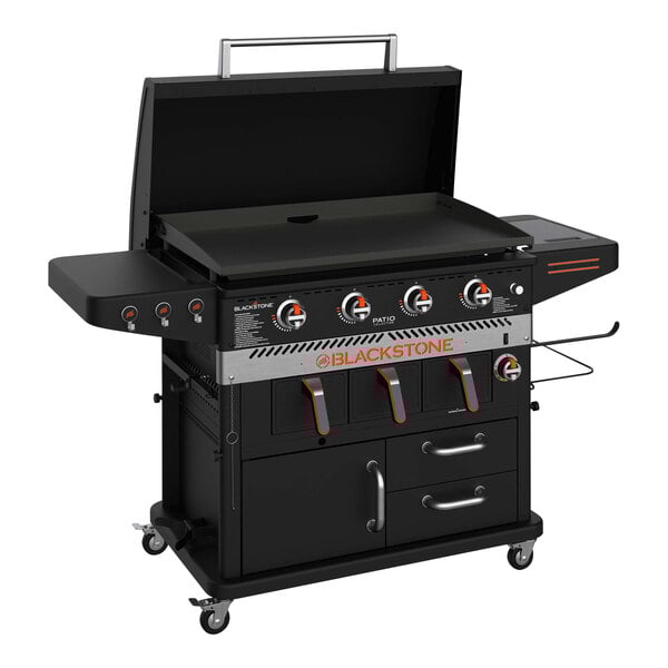A Blackstone black outdoor griddle with two burners and a grill.
