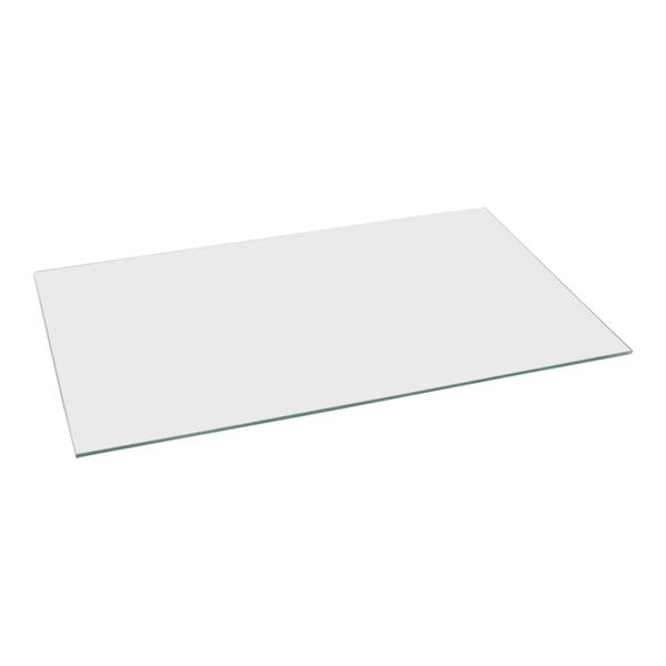 A glass plate with a metal handle.