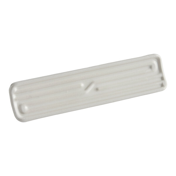 A rectangular, white, ridged object with rounded corners and a slightly raised surface, viewed against a plain background.