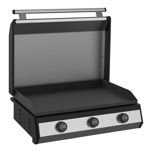 A black and grey Blackstone electric drop-in griddle with a hood.