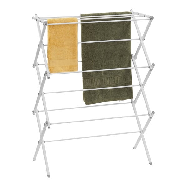 A white Household Essentials metal drying rack with two towels on it.