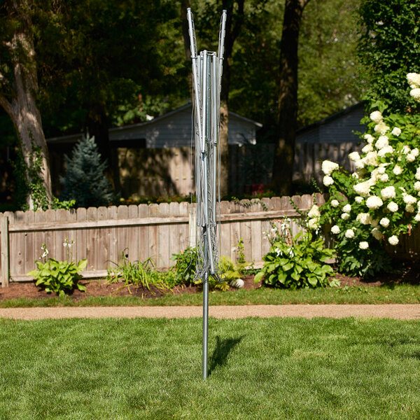 A metal outdoor drying rack with a metal pole and wires attached.