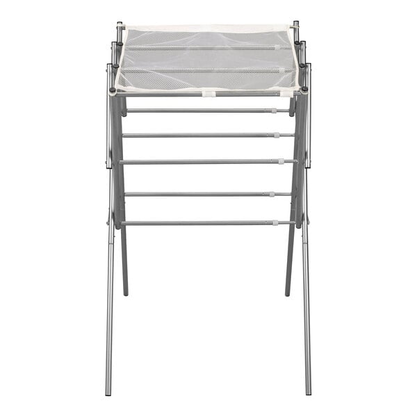 A silver metal Household Essentials drying rack with four metal rods.
