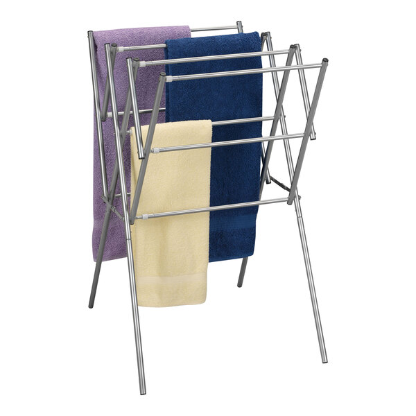 A silver metal Household Essentials collapsible drying rack with towels on it.