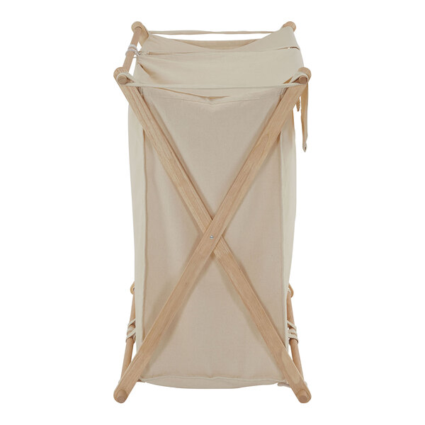 A white fabric laundry basket on a wooden folding frame.