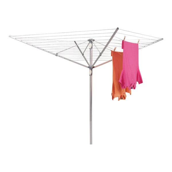 A Household Essentials aluminum outdoor umbrella drying rack with clothes drying on a clothesline.