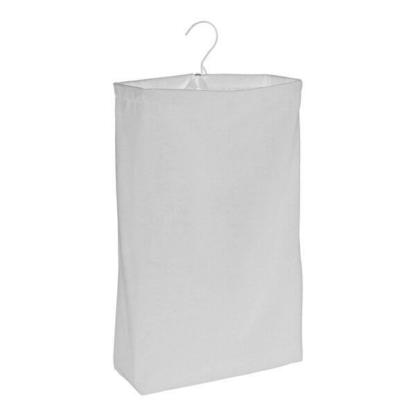 A white canvas laundry bag hanging on a white background.