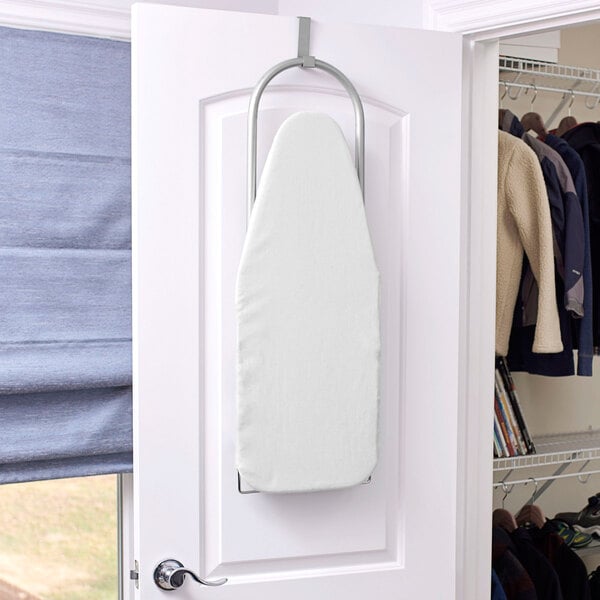 A white Household Essentials ironing board set up on a door.