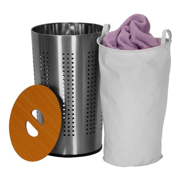 A round stainless steel laundry hamper with a white bag and a wooden lid.