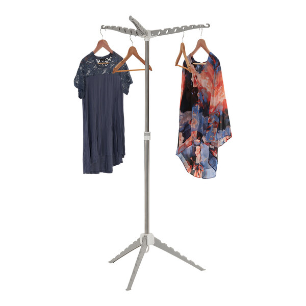 A Household Essentials tripod drying rack holding clothes.
