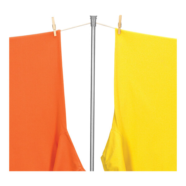 A metal pole with a yellow and orange clothes line hanging on it.