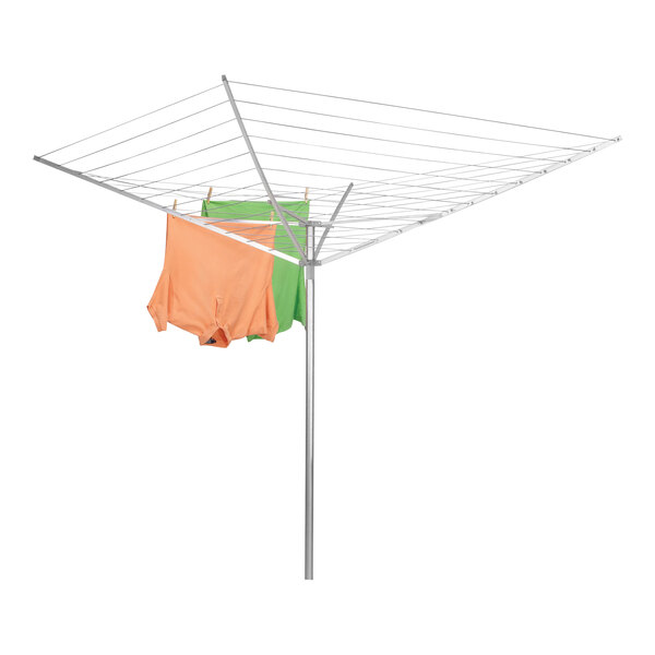 A Household Essentials rotary umbrella drying rack with orange and green clothes on it.