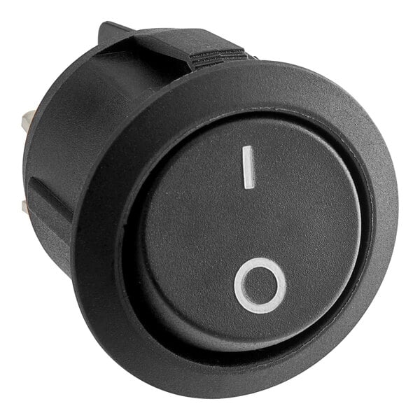A round black switch with a white circle on the center.