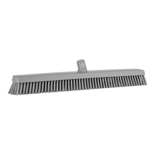 A close-up of a Vikan grey heavy-duty push broom head.