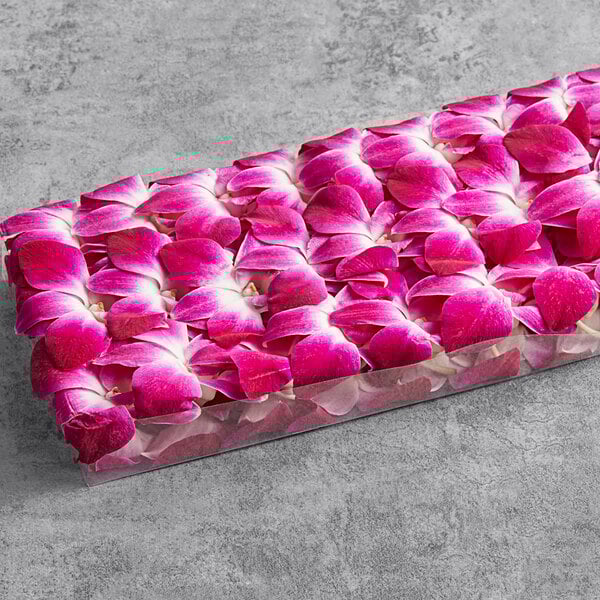 A rectangular box of purple orchids.