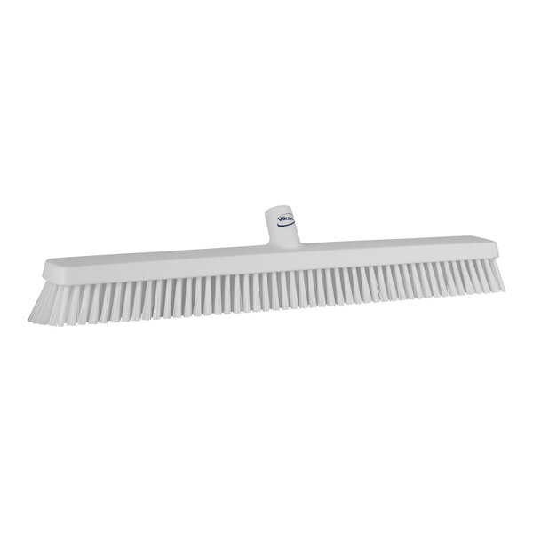 A white Vikan heavy-duty push broom head with soft/stiff bristles.