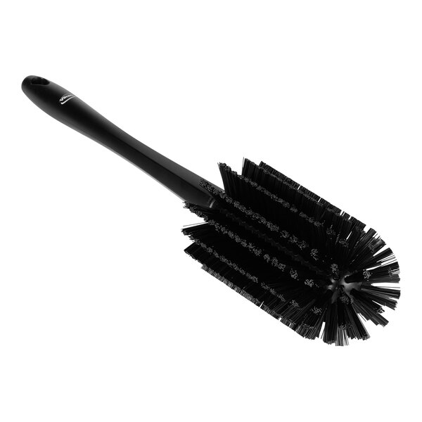 A black round Vikan pipe brush with a handle and bristles.