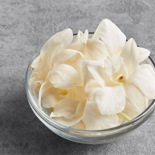 A bowl of white orchids.