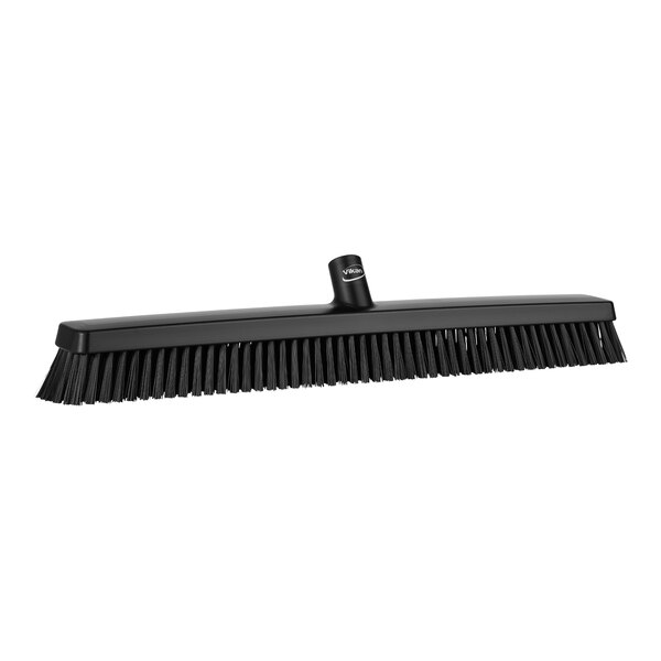 A Vikan black heavy-duty push broom head with soft and stiff bristles.