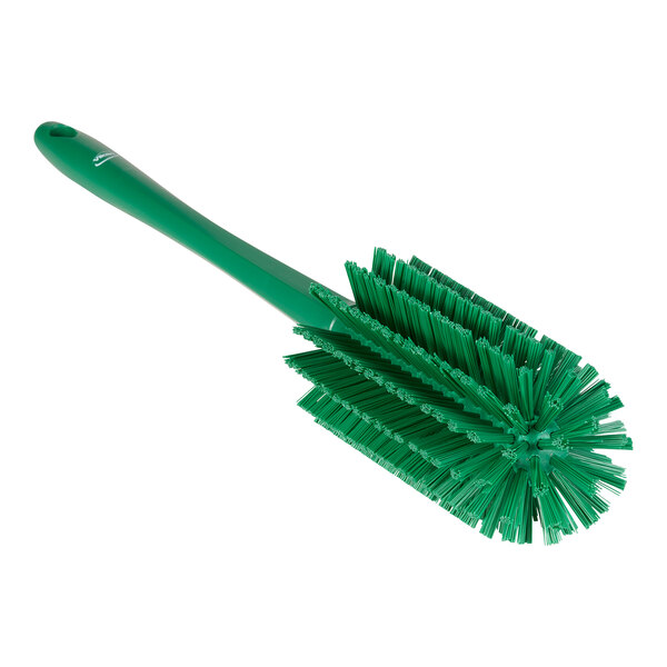 A green brush with bristles.