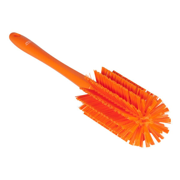 An orange Vikan medium pipe brush with bristles.