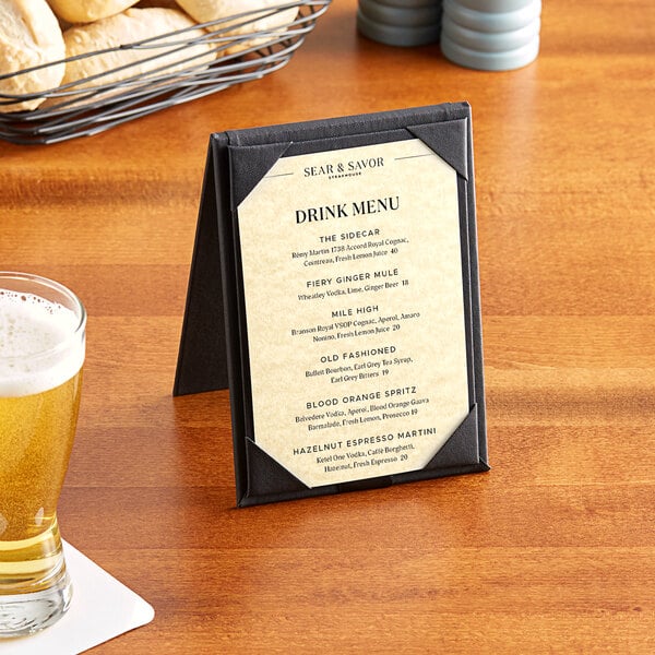 A Choice beige menu on a table with a beer glass and a glass of beer.