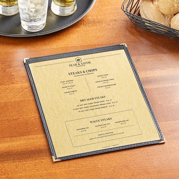 A Choice gold menu on a table with a glass of wine and a plate of food.