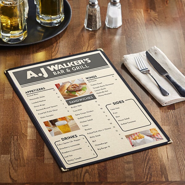 A menu on a table with a knife and fork on a napkin.