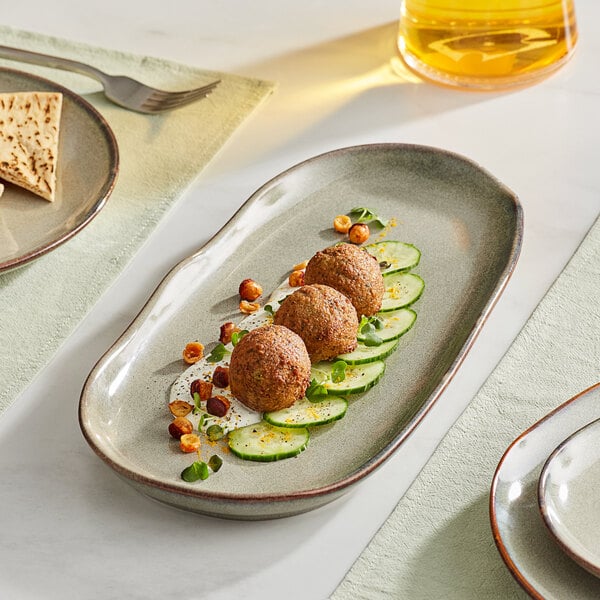 An Acopa rectangular heather gray china tray with food on it.