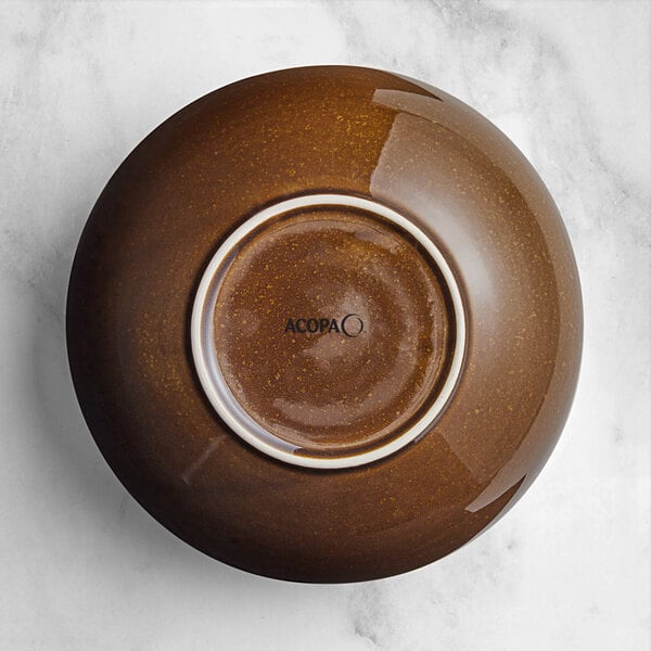 An Acopa Highlands brown china bowl with a white rim on a table.