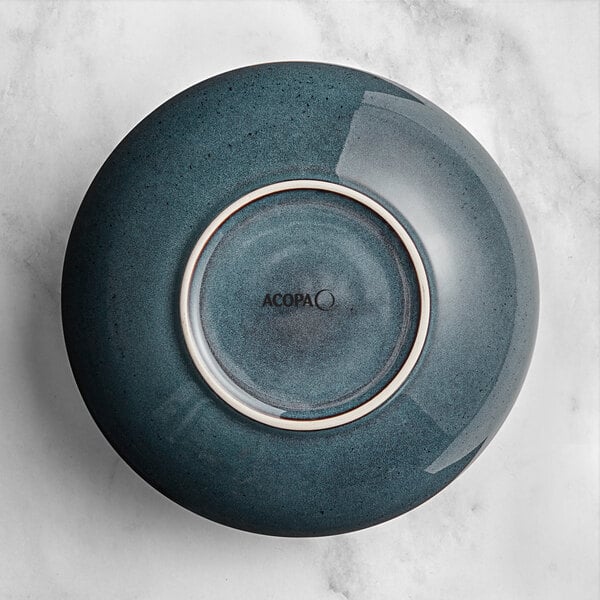 An Acopa Highlands blue china bowl with a white rim.