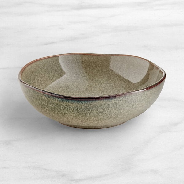 An Acopa Highlands heather gray china bowl with a speckled surface.